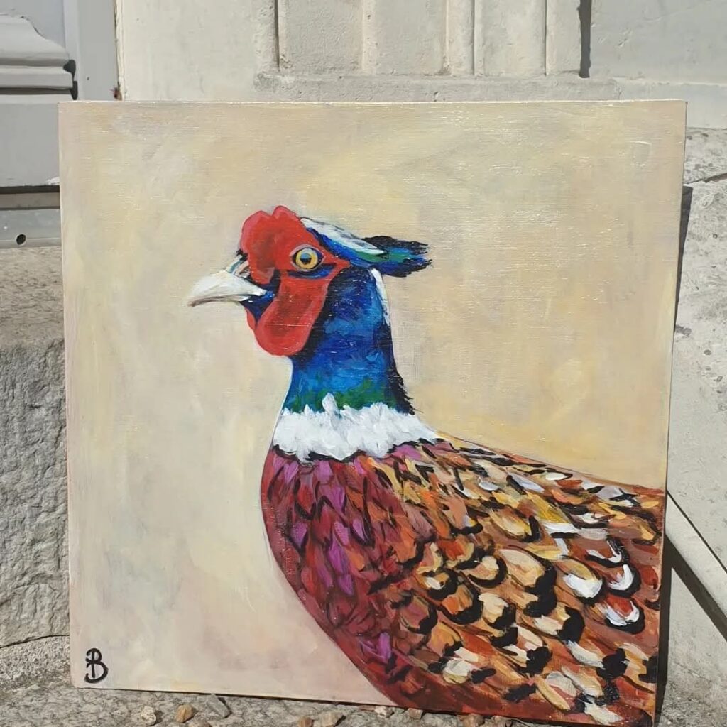 peinture de faisan plein de couleurs sur fond beige