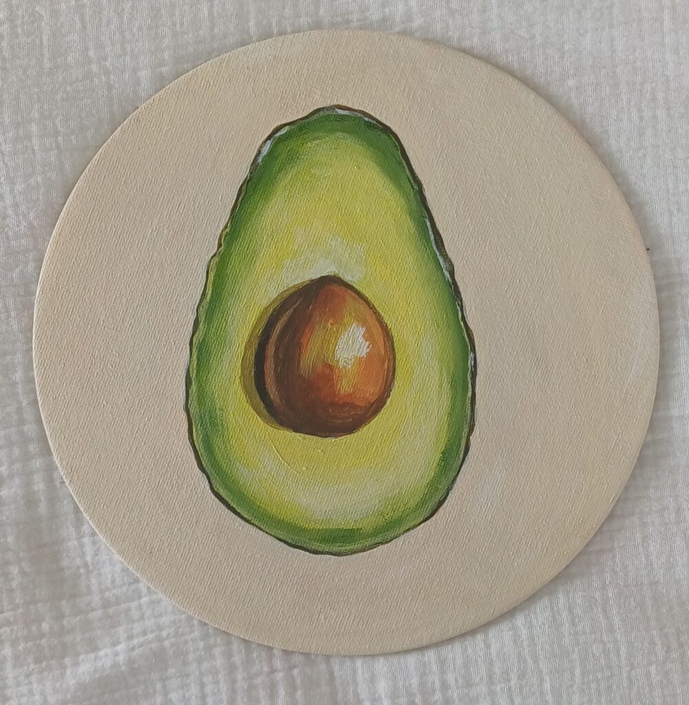 petit avocat peint sur une toile ronde